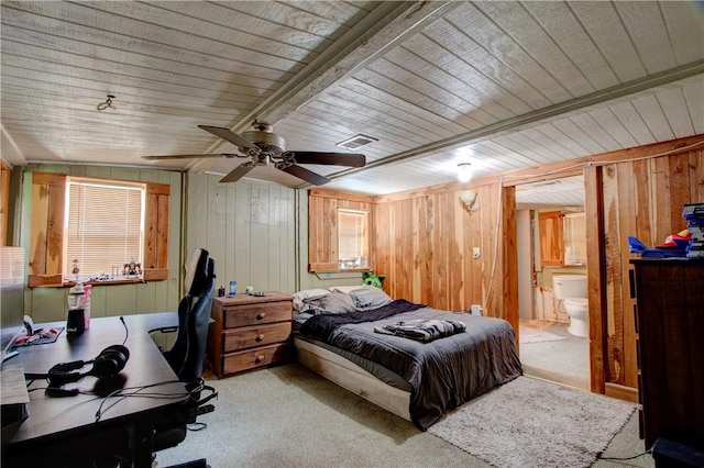 1162 N Sh 95, Bastrop, TX 78602 - carpeted bedroom with wooden walls, an office area, ensuite bathroom, and a ceiling fan