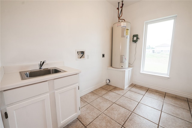 bathroom featuring water heater, tile patterned floors, and sink