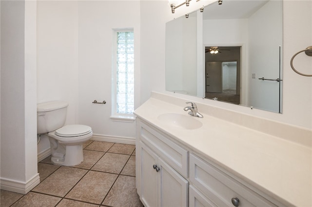 bathroom with vanity, ceiling fan, tile patterned floors, and toilet