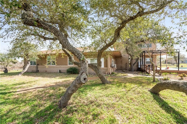 view of front of property featuring a front yard and stucco siding