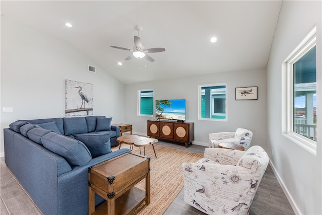 living room featuring vaulted ceiling, hardwood / wood-style flooring, and ceiling fan