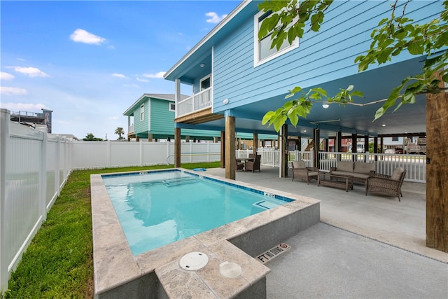 view of swimming pool with outdoor lounge area and a patio