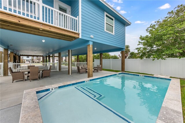 view of pool featuring a patio and an outdoor living space