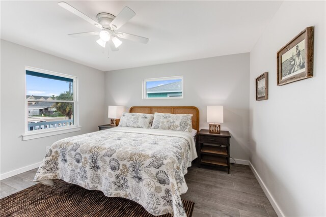 bedroom featuring dark hardwood / wood-style flooring and ceiling fan