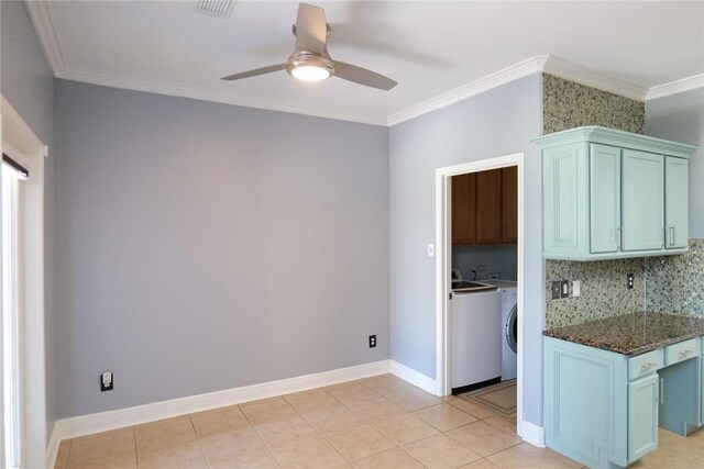 5710 Neustadt Dr, Corpus Christi, TX 78414 - kitchen featuring a ceiling fan, ornamental molding, separate washer and dryer, backsplash, and blue cabinets