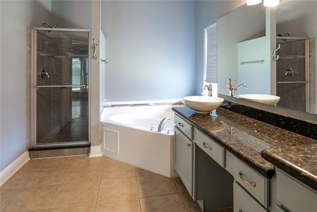 5710 Neustadt Dr, Corpus Christi, TX 78414 - full bathroom with a shower stall, a bath, double vanity, and tile patterned flooring