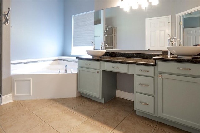 5710 Neustadt Dr, Corpus Christi, TX 78414 - bathroom featuring double vanity, tile patterned flooring, and a garden tub