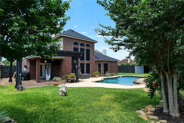 5710 Neustadt Dr, Corpus Christi, TX 78414 - back of house with brick siding, a patio, and a chimney