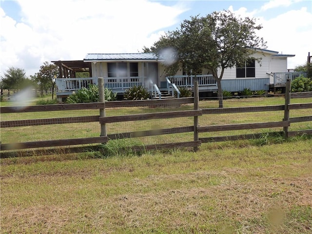 170 Barker Rd, Bayside, TX 78340 - manufactured / mobile home featuring a fenced front yard, covered porch, and a metal roof