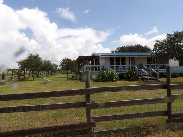 170 Barker Rd, Bayside, TX 78340 - view of front of property featuring covered porch, a metal roof, and a view of rural / pastoral area