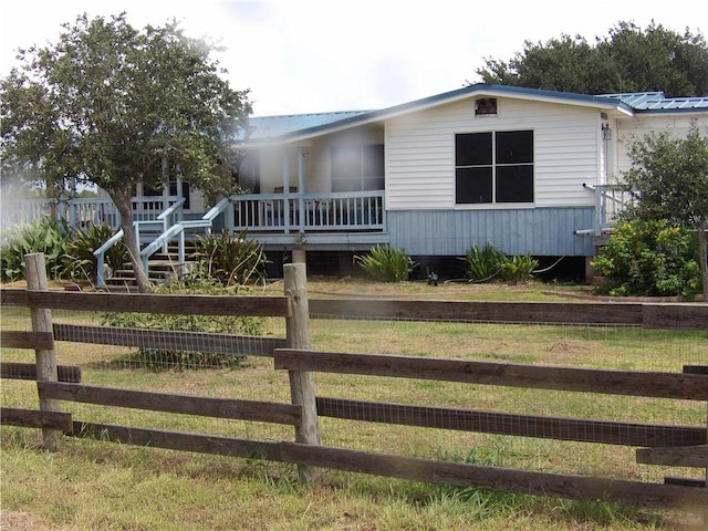 170 Barker Rd, Bayside, TX 78340 - manufactured / mobile home featuring a metal roof and covered porch