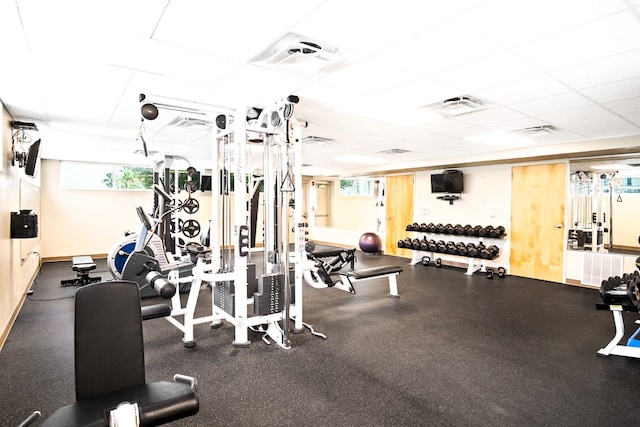 exercise room featuring a drop ceiling