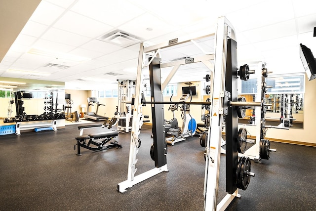 exercise room featuring a drop ceiling