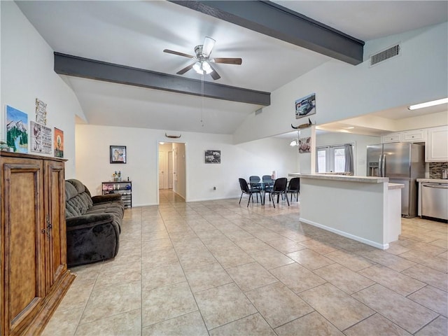 tiled living room with lofted ceiling with beams and ceiling fan