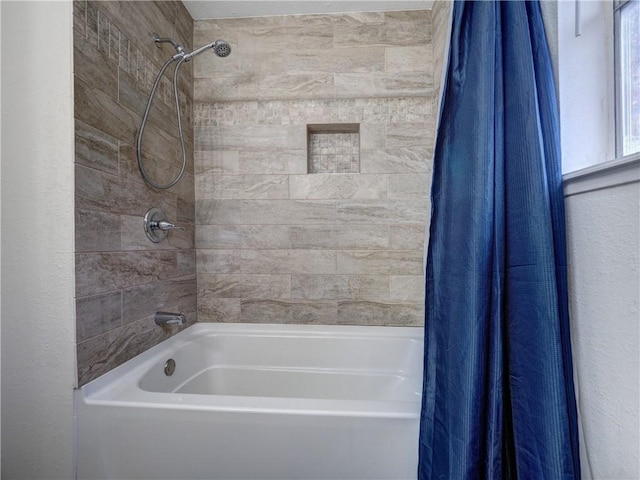 bathroom featuring shower / bath combination with curtain