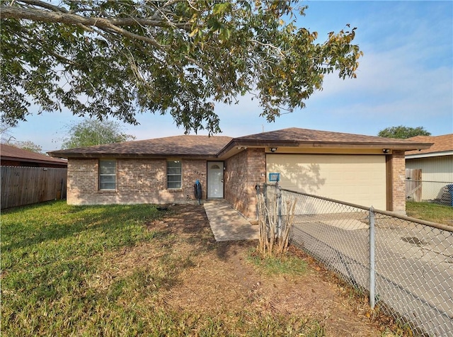 view of front of house featuring a garage and a front lawn