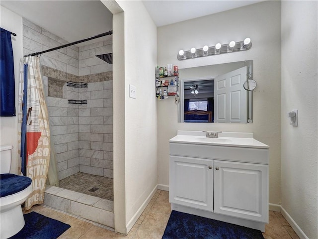 bathroom with curtained shower, tile patterned flooring, vanity, and toilet