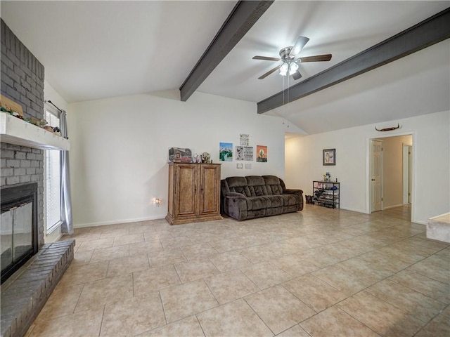 tiled living room featuring a fireplace, lofted ceiling with beams, and ceiling fan