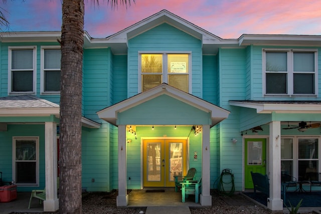 view of front of home featuring french doors and ceiling fan