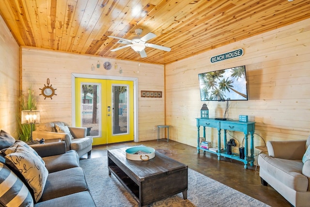 living room with wooden ceiling, wood walls, and french doors