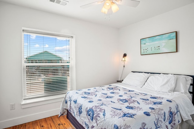 bedroom with hardwood / wood-style flooring and ceiling fan