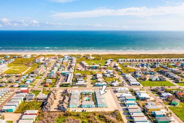 drone / aerial view featuring a view of the beach and a water view