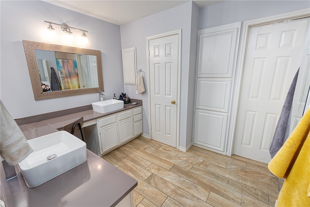 bathroom featuring wood-type flooring and vanity