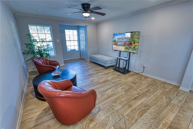 living room featuring hardwood / wood-style floors, ceiling fan, and ornamental molding