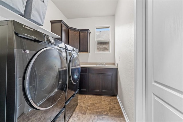 1035 Santa Catalina St, Portland, TX 78374 - laundry area featuring separate washer and dryer, cabinet space, baseboards, and a textured wall