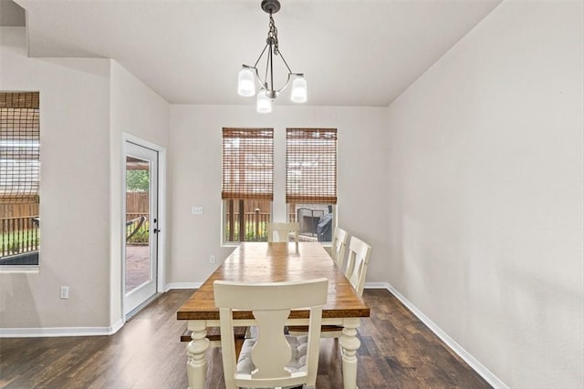 1035 Santa Catalina St, Portland, TX 78374 - dining space with dark wood-style floors, baseboards, and a chandelier