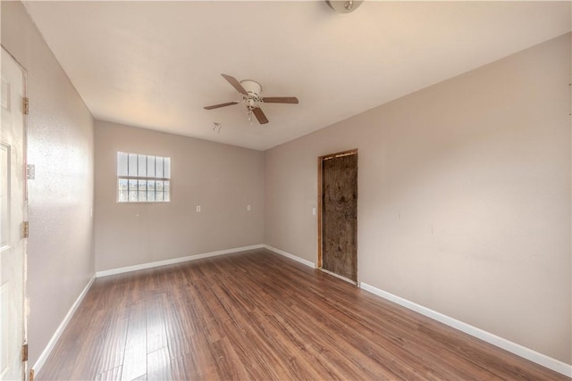 empty room with ceiling fan and wood-type flooring