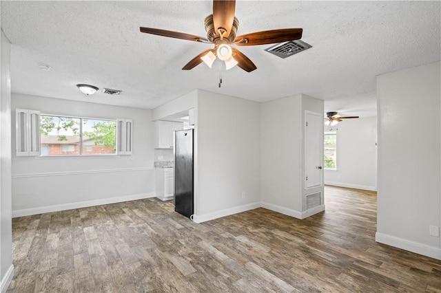 1729 Mermaid Dr, Corpus Christi, TX 78412 - spare room featuring a ceiling fan, a textured ceiling, wood finished floors, and baseboards