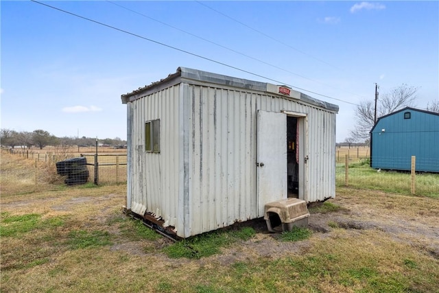 view of outbuilding with a rural view