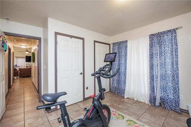 exercise area with light tile patterned floors