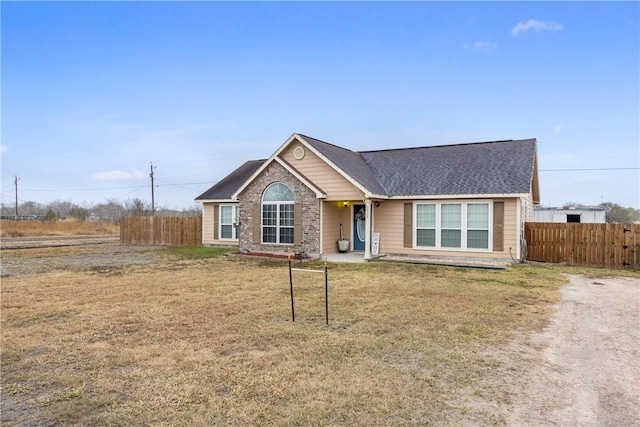 ranch-style home with a front lawn