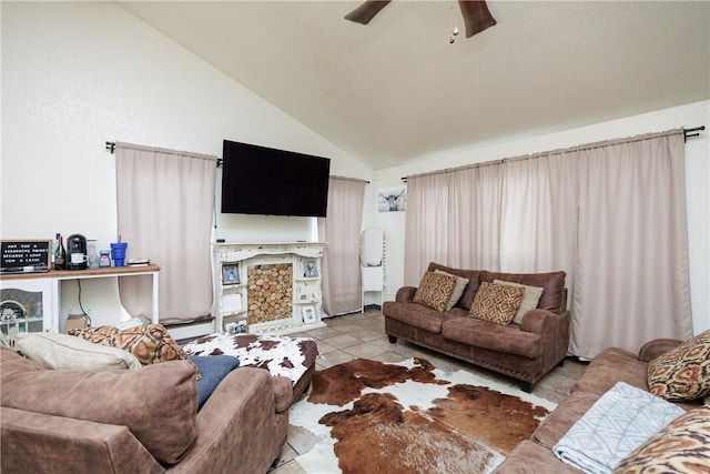 tiled living room featuring ceiling fan and high vaulted ceiling