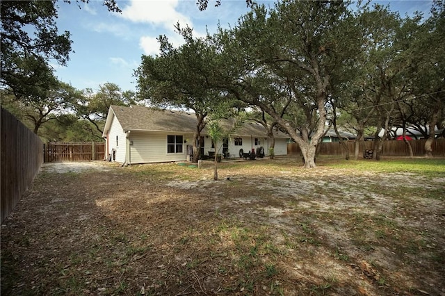 exterior space featuring a fenced backyard