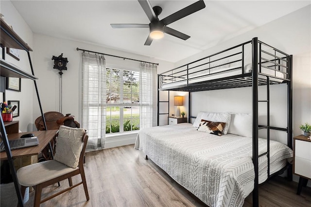 bedroom featuring a ceiling fan and wood finished floors