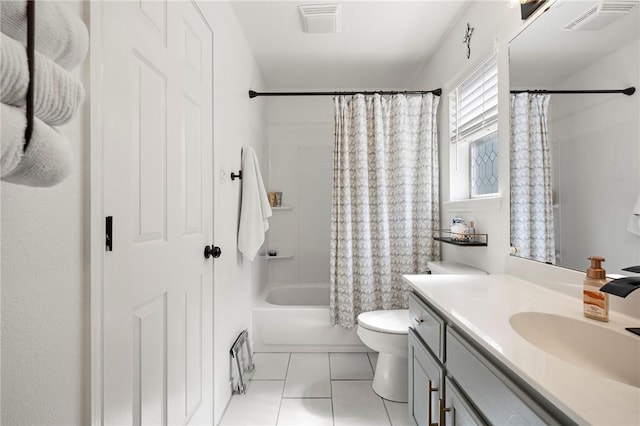 bathroom featuring vanity, toilet, tile patterned floors, shower / bath combo with shower curtain, and visible vents