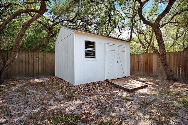 view of shed with a fenced backyard