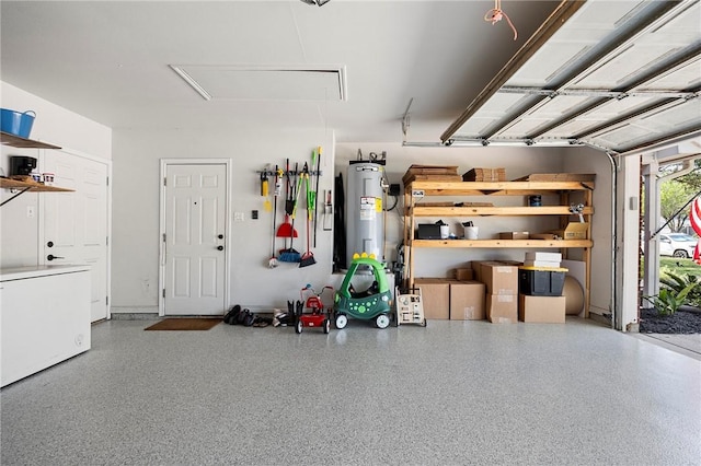 garage with water heater and refrigerator
