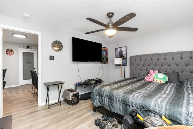 bedroom featuring ceiling fan and light hardwood / wood-style flooring