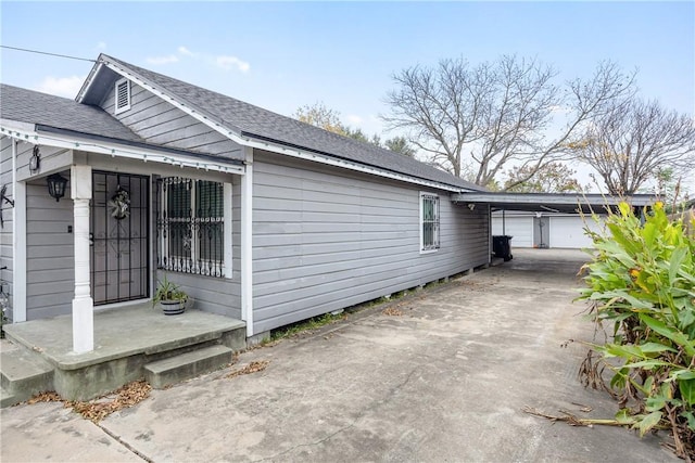 view of side of property with a carport