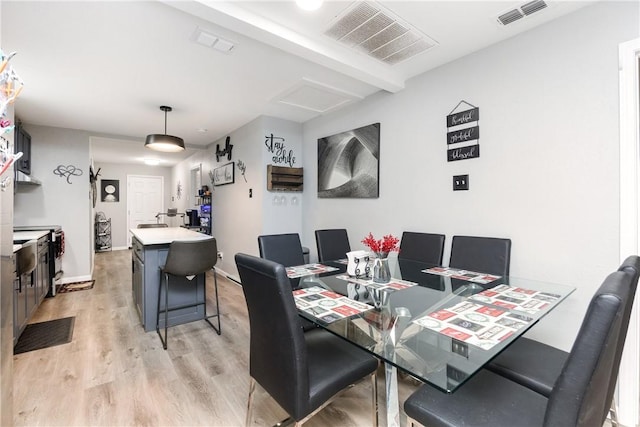 dining space featuring light hardwood / wood-style flooring