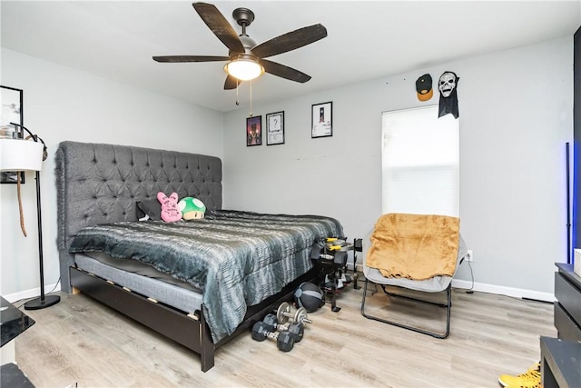 bedroom featuring hardwood / wood-style floors and ceiling fan