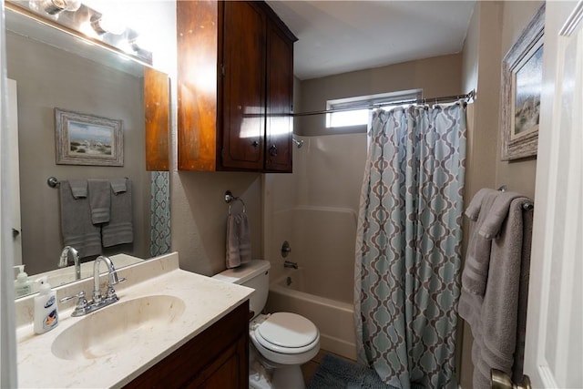 full bathroom with shower / bathtub combination with curtain, vanity, and toilet