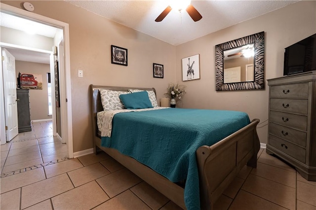 bedroom with tile patterned flooring and ceiling fan