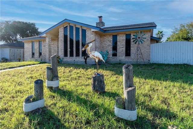 view of front of home with a front yard