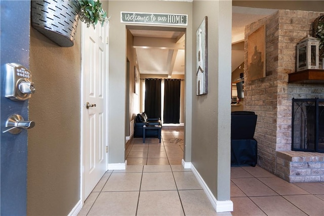 hall featuring light tile patterned flooring