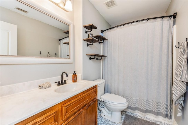 bathroom featuring visible vents, toilet, vanity, and a shower with curtain